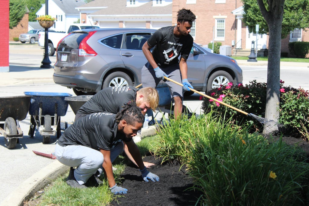 Young men gardening and doing yard work